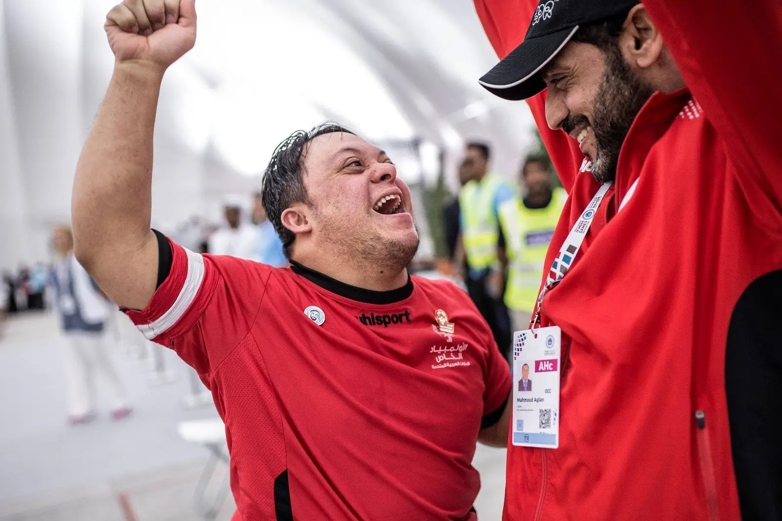 Special Olympian Cheering with Coach